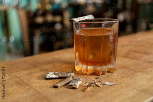 glass of drink on bar counter