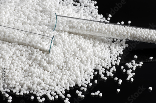 Obraz na płótnie Two laboratory tubes for research with a white plastic polymer