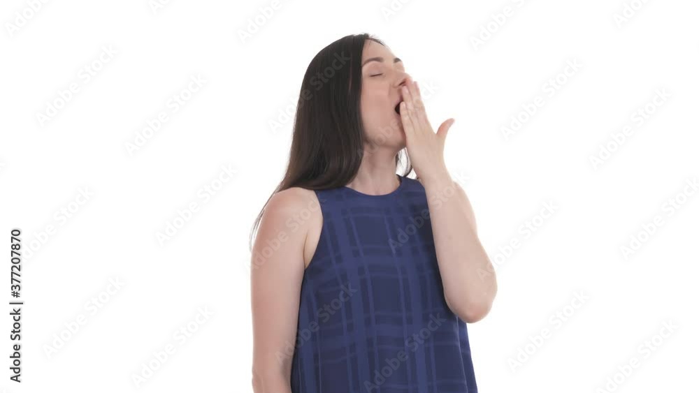Portrait of Caucasian sleepy woman after waking up, stretching up arms and yawning. Pandiculation act upon waking. Body language. Isolated on white background Portrait of Caucasian sleepy woman after waking up, stretching up arms and yawning. Pandiculation act upon waking. Body language. Isolated on white background