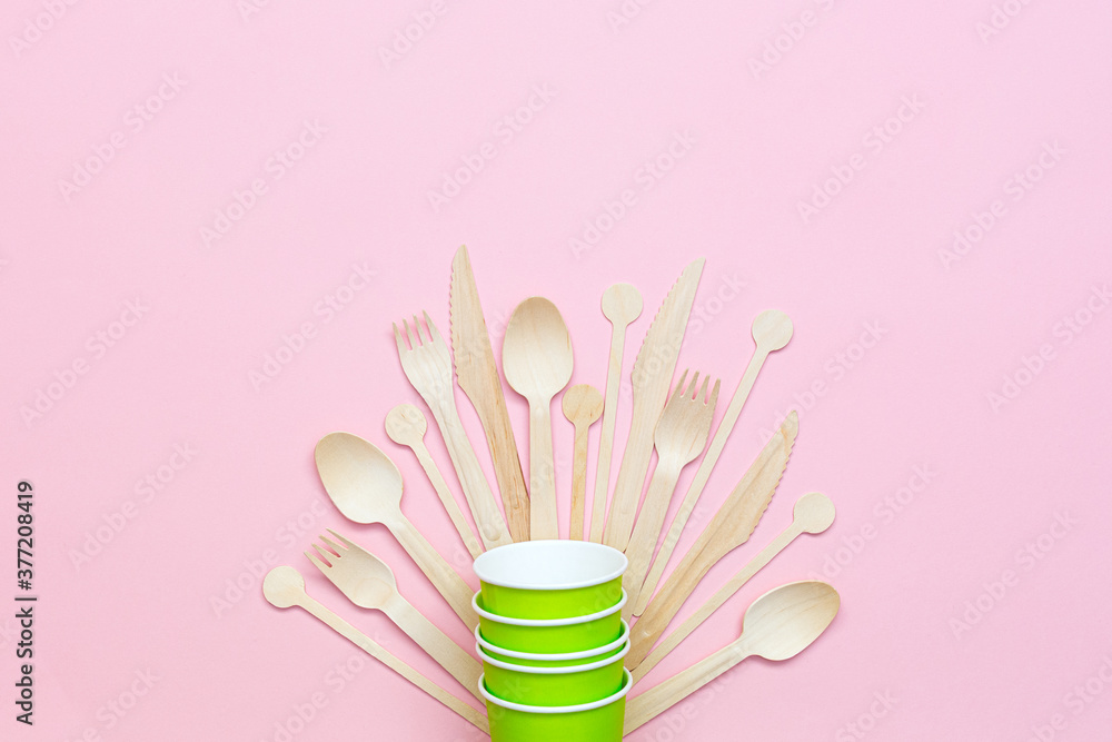 Eco wooden cutlery and paper cups. Flat lay