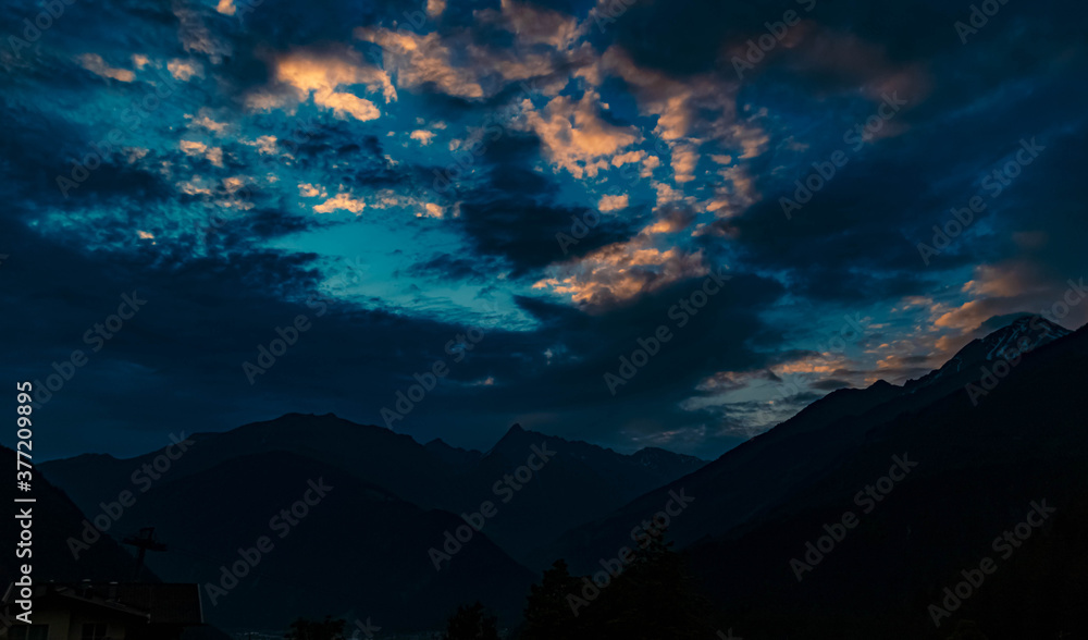 Beautiful sunrise with dramatic clouds near Finkenberg, Tyrol, Austria