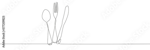 Fork spoon and knifeon white background photo