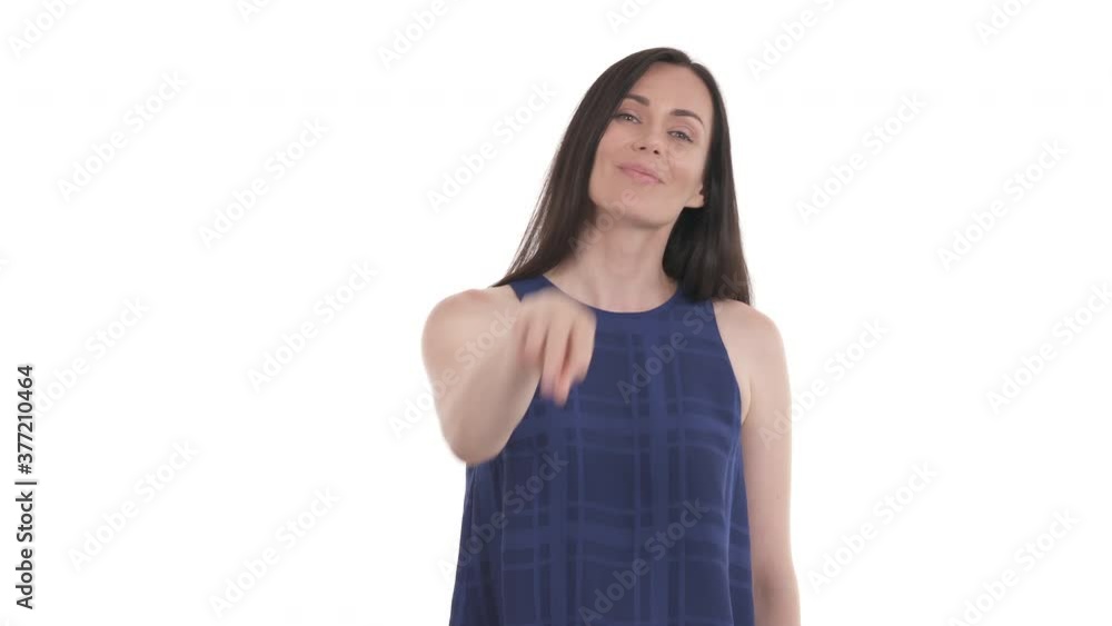 Caucasian woman doing I'm watching you gesture. Pointing two V-sign fingers at eyes. Isolated on white background Caucasian woman doing I'm watching you gesture. Pointing two V-sign fingers at eyes. Isolated on white background
