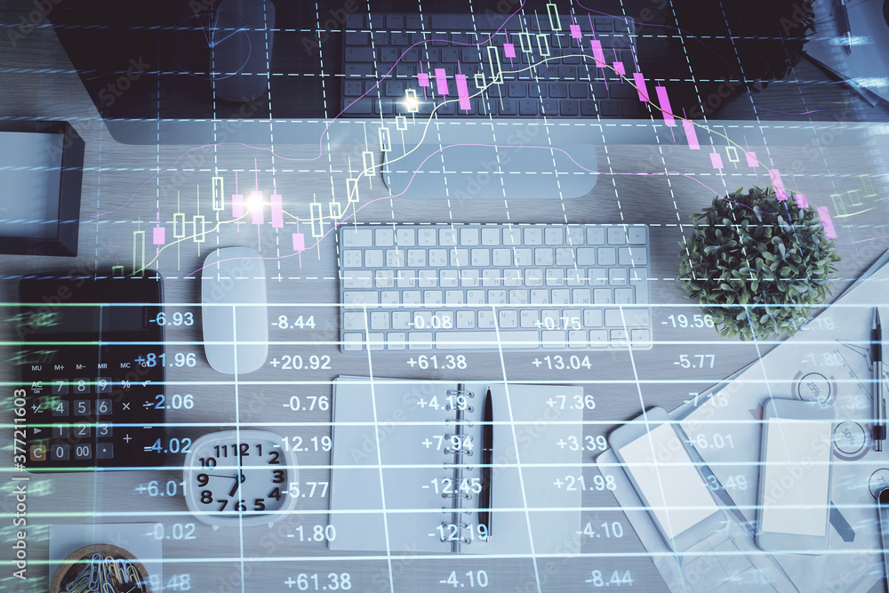 Double exposure of forex graph drawing over desktop background with computer. Concept of financial analysis. Top view. Double exposure of forex graph drawing over desktop background with computer. Concept of financial analysis. Top view.
