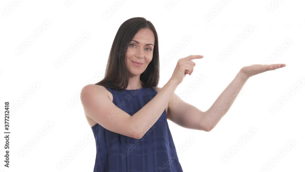 Caucasian woman holding copy space on palm and pointing to right side at empty place for advertisement. Isolated on white background Caucasian woman holding copy space on palm and pointing to right side at empty place for advertisement. Isolated on white background