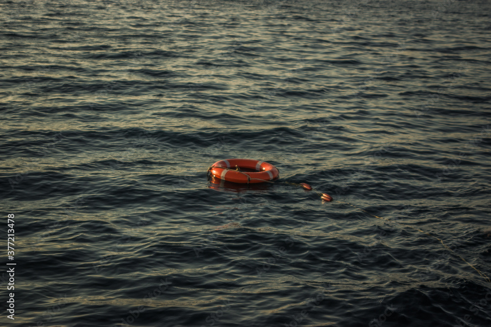 Fototapeta premium red lifebuoy thrown overboard in the black sea