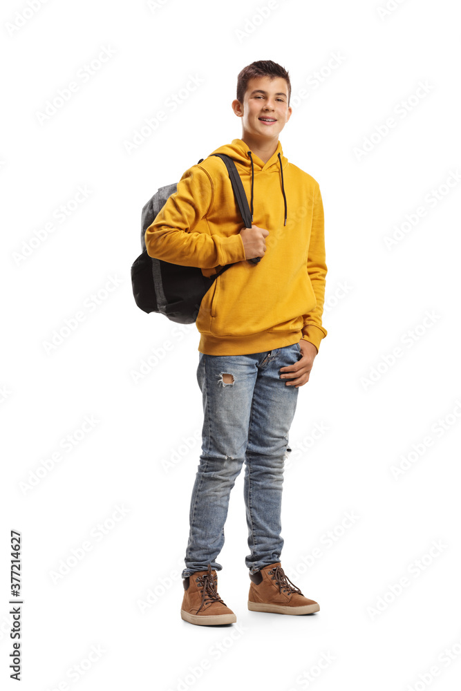Male teenage student in a yellow hoodie and a backpack smiling at the camera Male teenage student in a yellow hoodie and a backpack smiling at the camera
