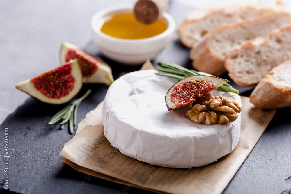Camembert with honey, nuts, figs and rosemary, gastronomic delight