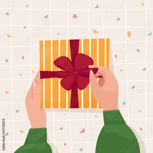 Hands holding and opening a gift. Cute Vector illustration in cartoon flat style for banner, poster, New Year, Merry Christmas, Valentines or Happy Birthday greeting card