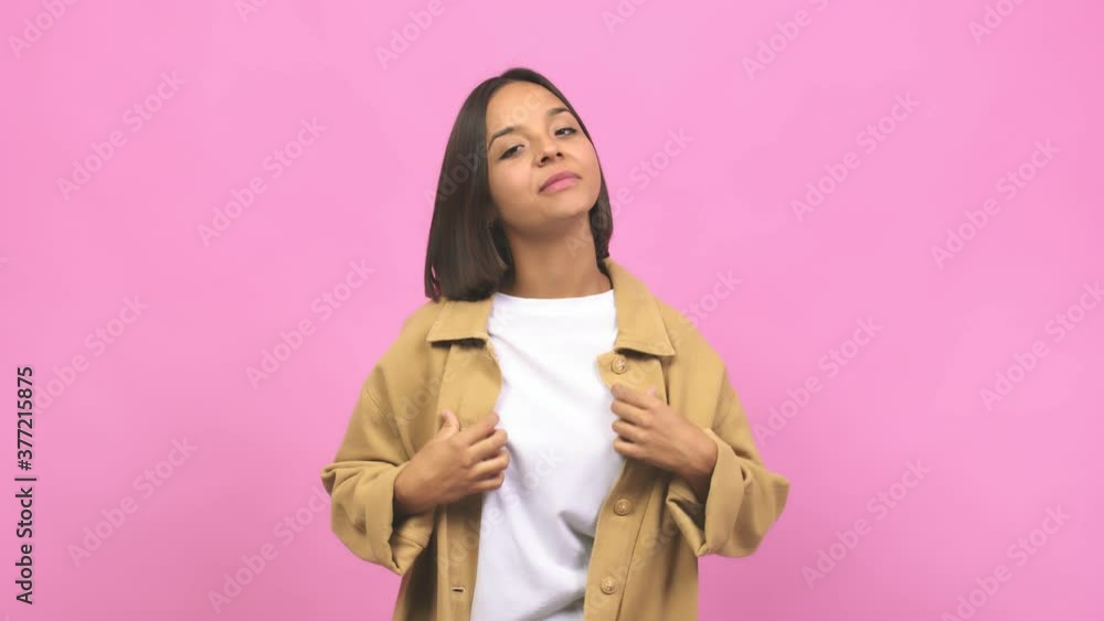 Young indian woman showing number one, symbol of counting, concept of mathematics, confident and cheerful Young indian woman showing number one, symbol of counting, concept of mathematics, confident and cheerful