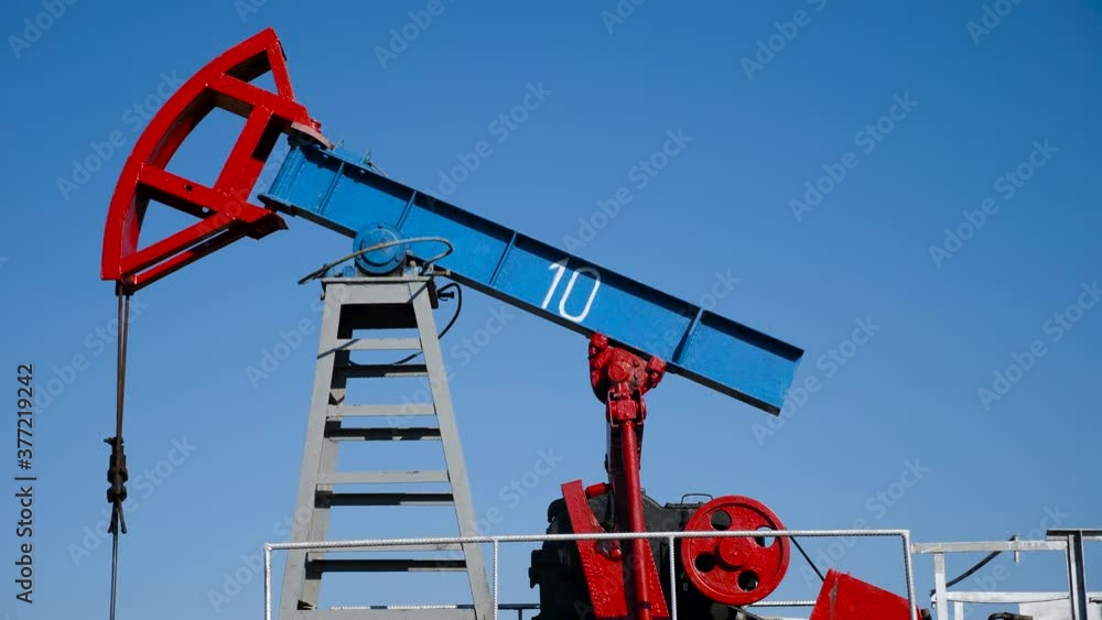 oil rig stands in a field and extracts minerals from the ground oil rig stands in a field and extracts minerals from the ground