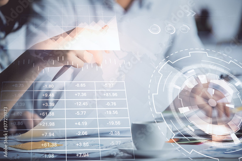 Double exposure of forex graph drawing over people taking notes background. Concept of financial analysis