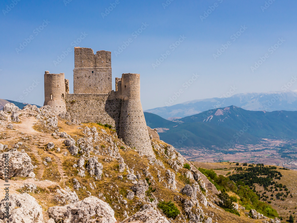 Evocative view of Rocca Calascio ruins, ancient medieval fortress in Gran Sasso National Park, Abruzzo region, Italy
