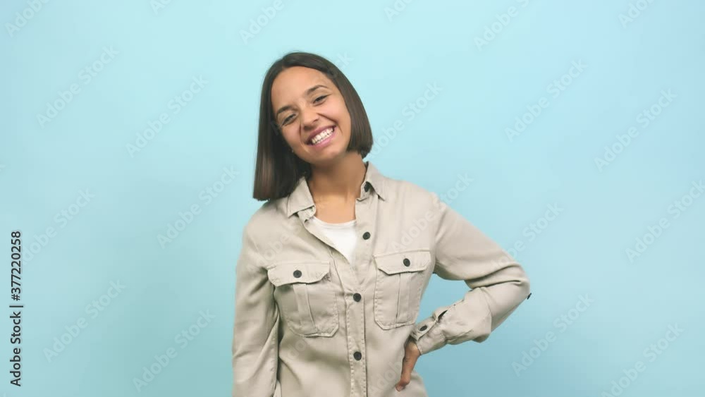 Young indian woman shouting and enjoying, looking with one eye, surprised and having fun Young indian woman shouting and enjoying, looking with one eye, surprised and having fun