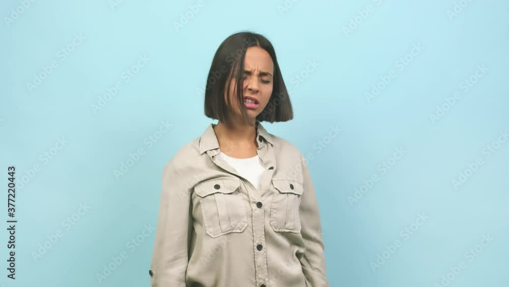 Young indian woman suffering neck pain due to excessive computer use Young indian woman suffering neck pain due to excessive computer use