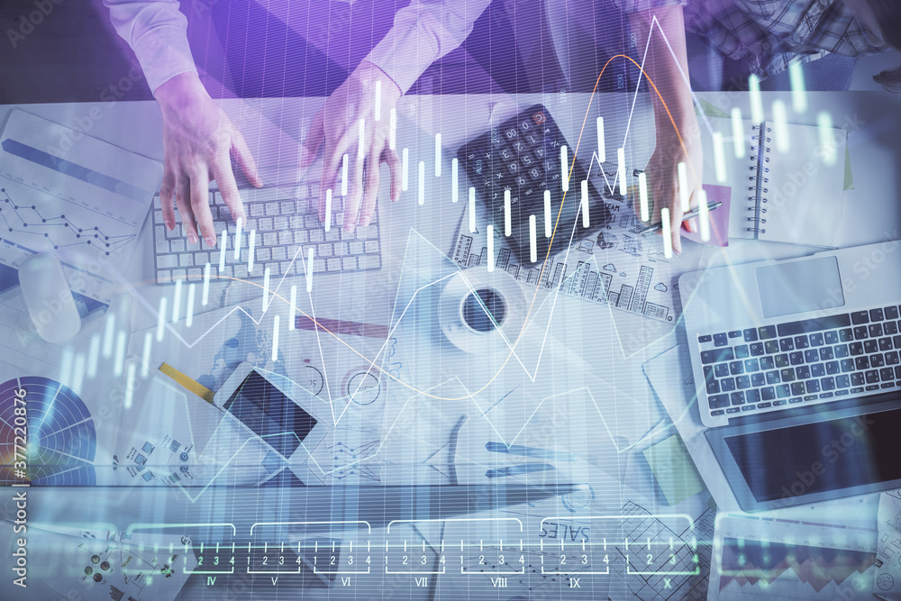 Double exposure of man and woman working together and financial chart hologram drawing. market analysis concept. Computer background. Top View. Double exposure of man and woman working together and financial chart hologram drawing. market analysis concept. Computer background. Top View.
