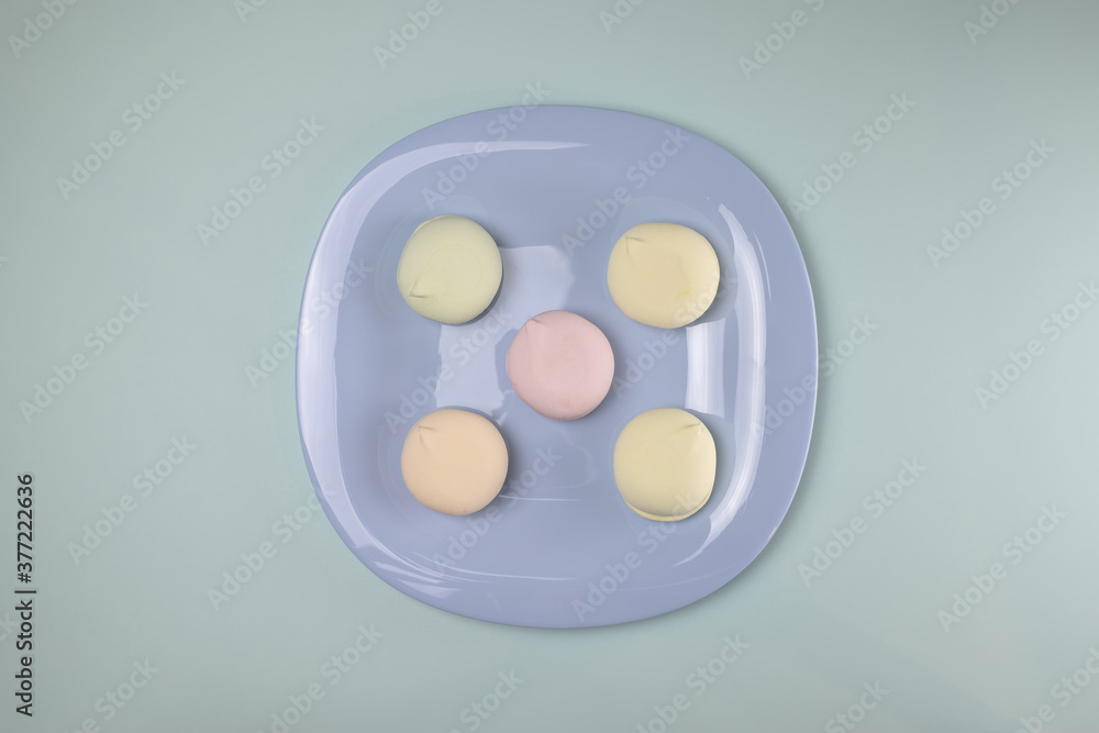Five cakes on a blue plate. Pattern. Five cakes on a blue plate. Pattern.