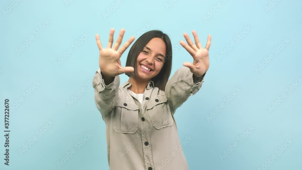 Young indian woman showing number ten, symbol of counting, concept of mathematics, confident and cheerful