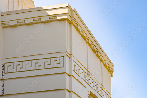 Exterior wall design on Greek architecture building. Details of beaux-arts deco style. photo