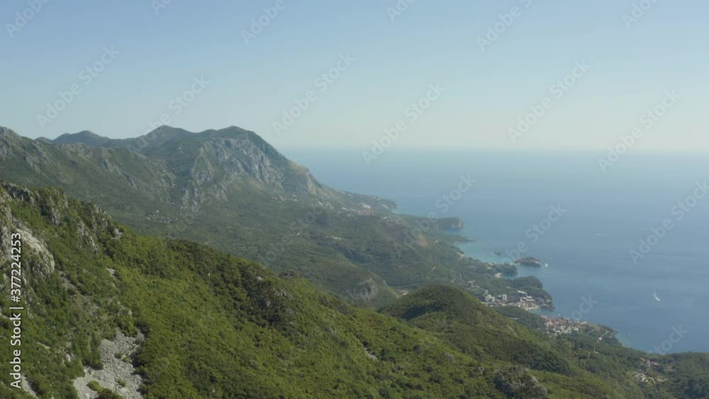 Aerial view Montenegro. Drone video showing mountains with trees, rocks with beautiful landscape and coastline, and the Adriatic Sea with waves. Aerial view Montenegro. Drone video showing mountains with trees, rocks with beautiful landscape and coastline, and the Adriatic Sea with waves.