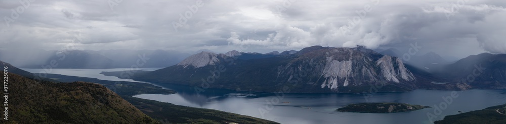Panoramic View Canadian Nature on top of Nares Mountain during fall season. Located in Carcross, near Whitehorse, Yukon, Canada. Background Panorama Panoramic View Canadian Nature on top of Nares Mountain during fall season. Located in Carcross, near Whitehorse, Yukon, Canada. Background Panorama
