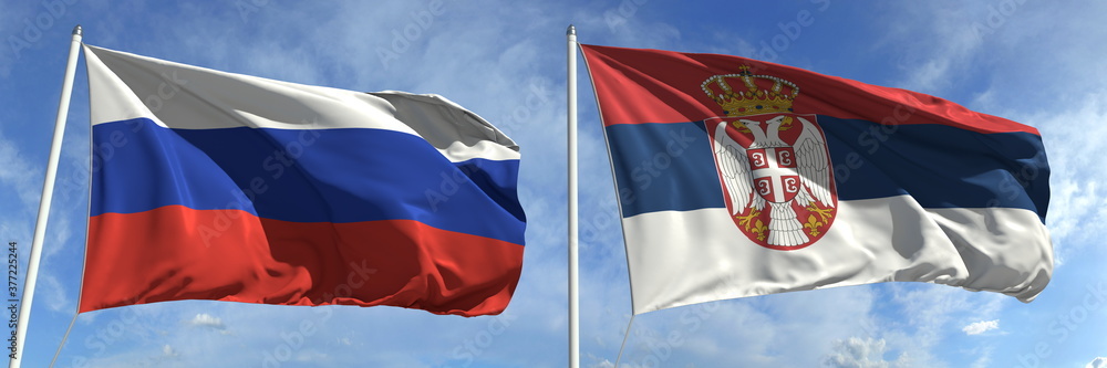 Waving flags of Russia and Serbia on flagpoles, 3d rendering