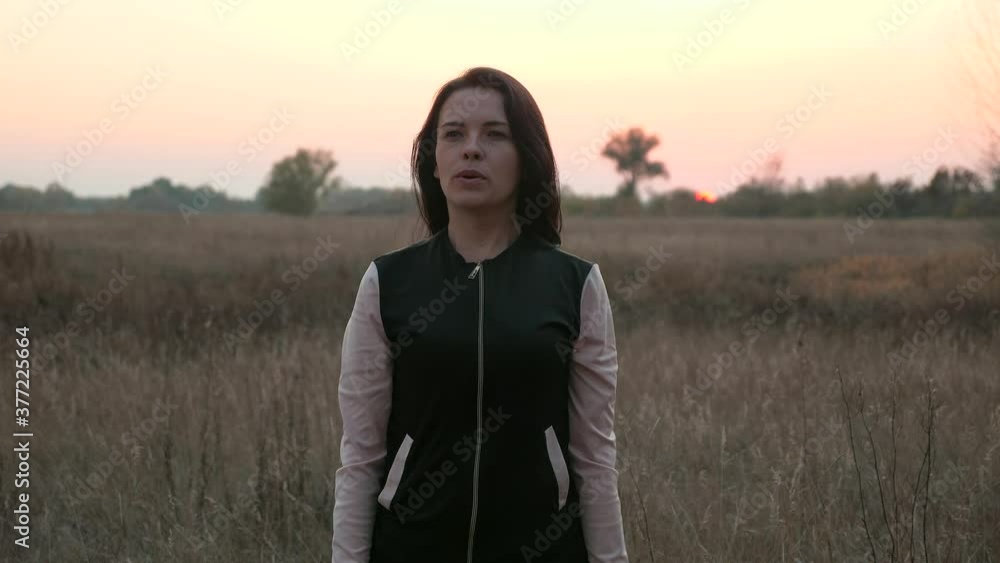 Young Woman Doing Exercise in Front of Sun Beyond Horizon. Evening Morning Sunrise Sunset Background. 2x Slow motion 60 fps Young Woman Doing Exercise in Front of Sun Beyond Horizon. Evening Morning Sunrise Sunset Background. 2x Slow motion 60 fps