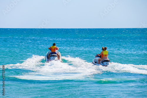 a man rides a jet ski in the open sea