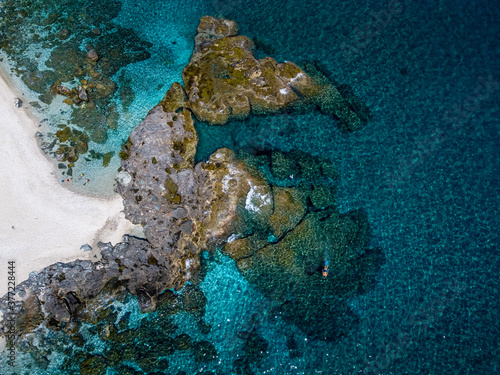The beautiful rocks of Plaka beach and the amazing blue Aegean Sea at Pelion Peninsula, Greece. Photo taken whit drone.