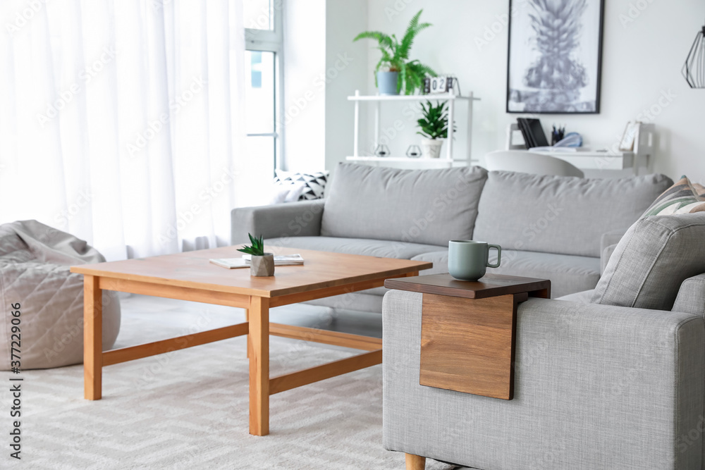 Fototapeta premium Armrest table on sofa in interior of room