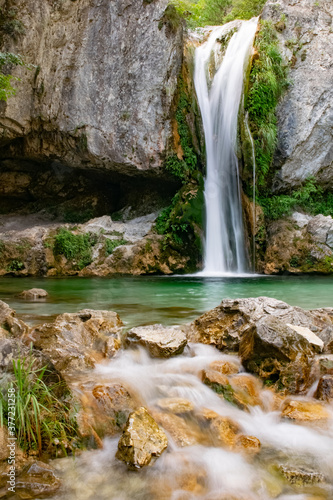 Long exposure image of waterfall and water flowing between rocks in the Mount Olympus  Greece