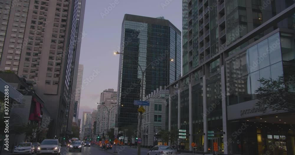 Montreal, Canada - April 15th 2017 : Tilt shot while driving on Rene Levesque Boulevard with view of La Laurentienne Building and other downtown skyscrapers. Montreal, Canada - April 15th 2017 : Tilt shot while driving on Rene Levesque Boulevard with view of La Laurentienne Building and other downtown skyscrapers.