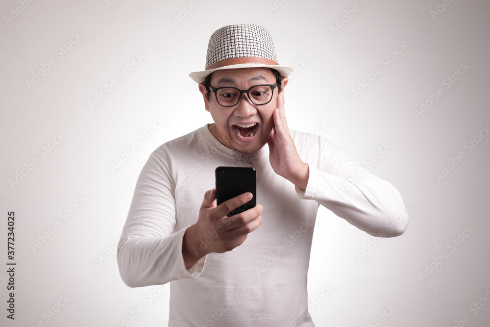 Young Man Texting Reading Chatting on His Phone Surprised Gesture Young Man Texting Reading Chatting on His Phone Surprised Gesture