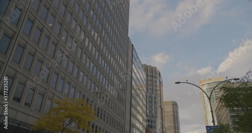 Montreal, Canada - April 15th 2017 : Zoom out shot of corporate headquarters concrete buildings, skyscrapers and towers, Rene Levesque Boulevard, Downtown. photo
