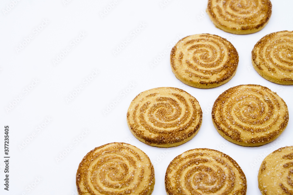 Round cookies. Curled cookies with sugar. Round cookies sprinkled with sugar.