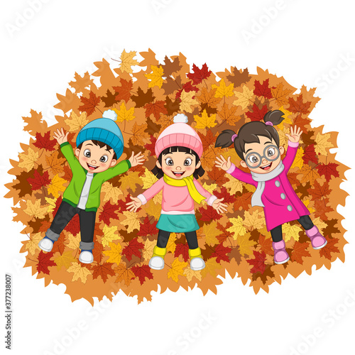 Cartoon Happy kids lying on colorful autumn leaves