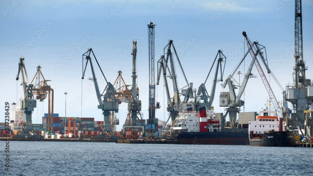 Sea port with cranes and docks early in the morning in Thessaloniki, Greece Sea port with cranes and docks early in the morning in Thessaloniki, Greece