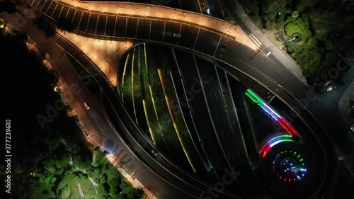 Vista aérea cenital nocturna sobre la Fuente de Petróleos iluminada con los colores de la Bandera Mexicana con motivo del mes de septiembre. photo