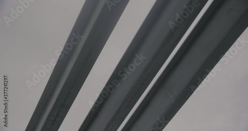 Montreal, QC, Canada - November 15, 2017: Worm eye view of Concrete highway overpass Columns during construction with cloudy sky in the background.