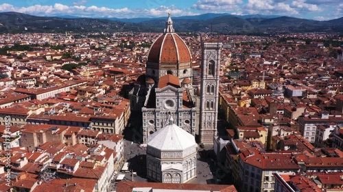 Wallpaper Mural Aerial view of Cathedral of Santa Maria del Fiore flying and zooming in with city and mounatins on a sunny day in Florence in Italy in 4k. Torontodigital.ca