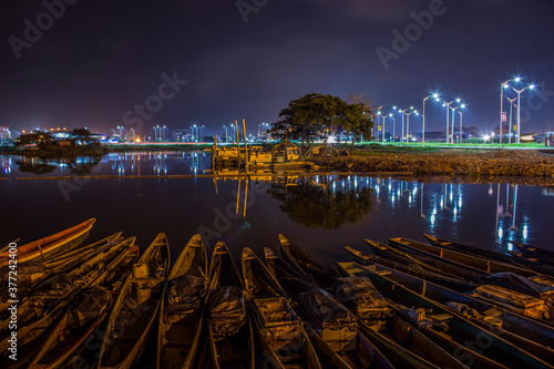 companies channel with craft ships and night lights, low exposition photo