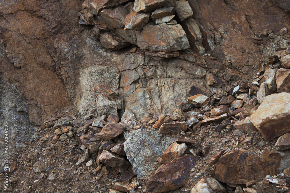 Rocky background. Grunge rock. Fragments of stones.