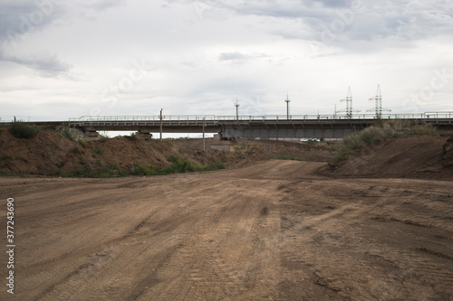 Road construction. Laying a new road in the steppe. Kazakhstan, Ust-Kamenogorsk. Construction Site