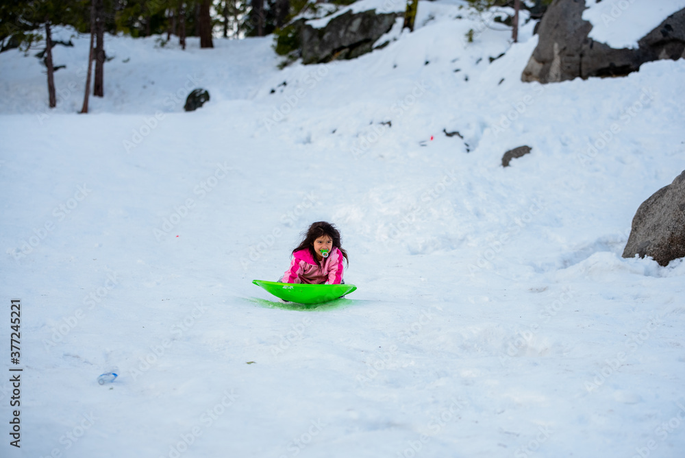 child playing with snow child playing with snow
