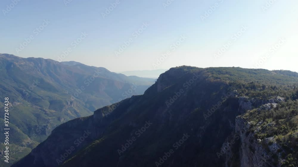 Aerial shot of the Grlo Sokolovo gorge, Korita, Montenegro. Drone view on Incredibly huge canyon, mountain peaks and rocks. Aerial shot of the Grlo Sokolovo gorge, Korita, Montenegro. Drone view on Incredibly huge canyon, mountain peaks and rocks.