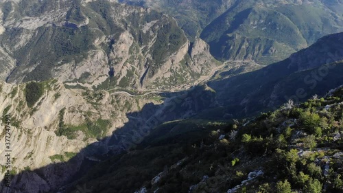 Aerial shot of the Grlo Sokolovo gorge, Korita, Montenegro. Drone view on Incredibly huge canyon, mountain peaks and rocks. photo