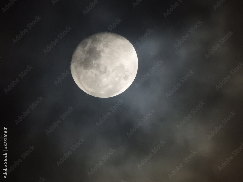 Bright moon through mist