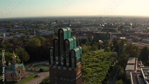 The Hochzeitsturm Darmstadt at the Mathildenhoehe by a drone with the city in the background on a sunny summer day photo