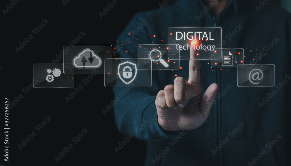 Business and technoloy concept.Business man touch digital tecchnology screen interface and a businessman in background. Business and technoloy concept.Business man touch digital tecchnology screen interface and a businessman in background.