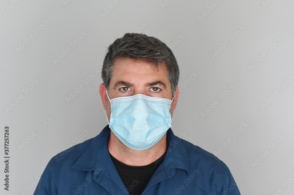 Adult man wearing a face mask Adult man wearing a face mask